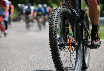 gravel bike tire flat during an uphill cycling race with other bikes