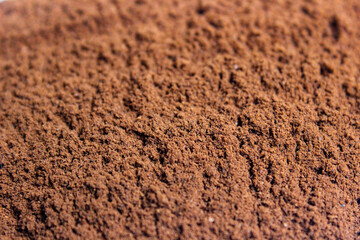 Roasted coffee powder, food background.