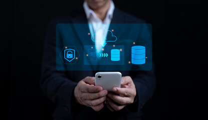 Man uses a smartphone to see a virtual screen. cloud computing. storing of data. Concept of internet services and networking. DMS data management system available for download and upload online.