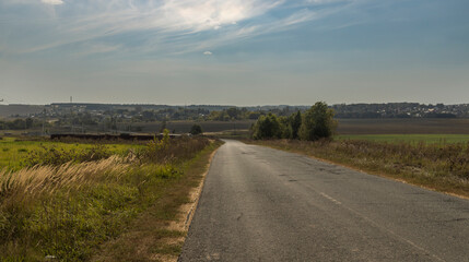 A road with a few trees in the background