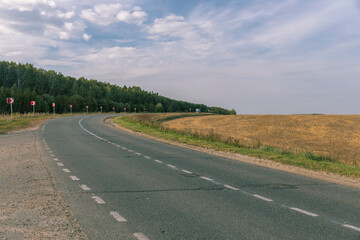 A road with a few trees in the background