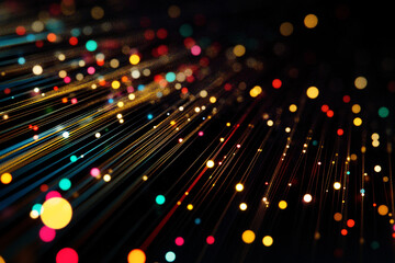 Streams of vibrant multicolored light particles moving across a dark background creating a dynamic abstract scene
