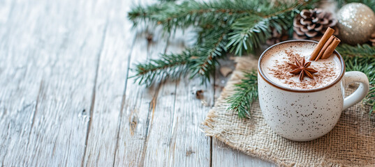 A cozy mug of hot chocolate, topped with whipped cream, cinnamon stick, background with copy space.