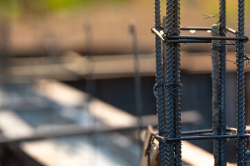 Concrete footings and reinforcing steel rods at a construction site. Groundwork for new building...