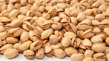 Tasty pistachios isolated on a white background.