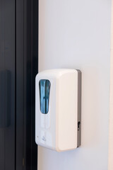 a touch-sensitive dispenser for antiseptic or soap on the wall