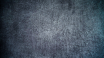 Dark gray leather background texture.