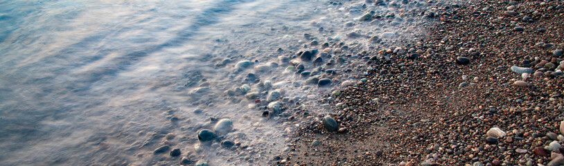 Colorful sunset with waves on the sea