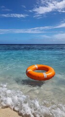 Orange Lifebuoy Floating in Crystal Clear Ocean Water