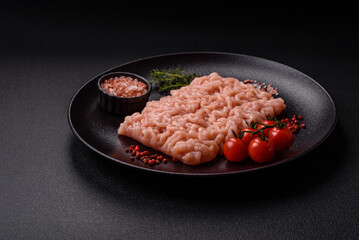 Fresh raw chicken mince with salt, spices and herbs