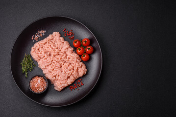 Fresh raw chicken mince with salt, spices and herbs