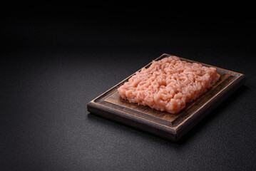 Fresh raw chicken mince with salt, spices and herbs