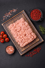 Fresh raw chicken mince with salt, spices and herbs