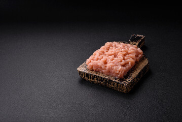Fresh raw chicken mince with salt, spices and herbs