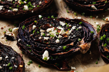 Baked red cabbage steaks with herbs and feta cheese