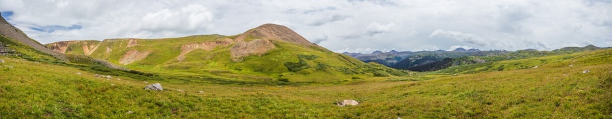 mountain tundra meadow panorama with overcast skies