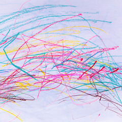 Bright and cheerful crayon scribbles on the wall, a child's artistic endeavor