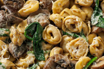Chestnut Mushrooms and spinach tortellini served with parmesan cheese