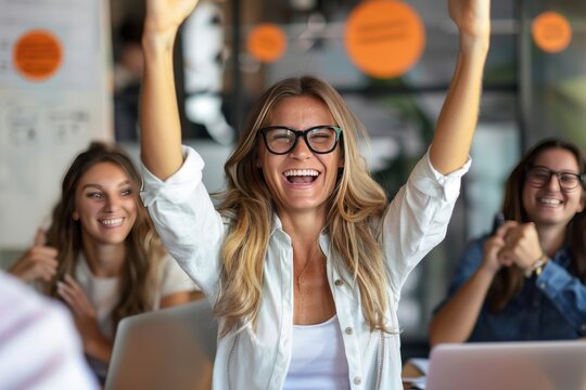 Woman in Glasses Raising Hands With Excitement in Meeting