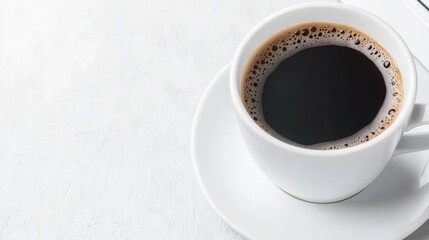 Freshly brewed black coffee in white cup on minimalist tabletop
