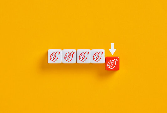 White arrow pointing at red cube with tape dispenser icon on yellow background