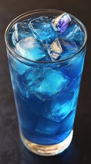 Refreshing Blue Beverage with Ice Cubes in Glass - Perfect Summer Drink - Quench Your Thirst with Cool Blue Cocktail for Relaxation and Refreshment
