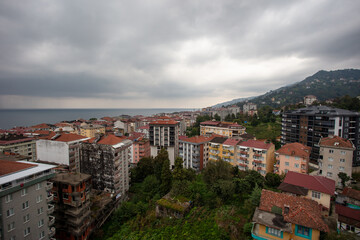 Panoramic View of Çayeli, Rize, Turkey Overlooking the Black Sea on a Cloudy Day with Coastal and Urban Scenery