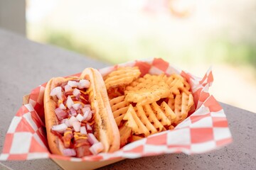 Hot dog and milkshake set on the stone with a blurry background