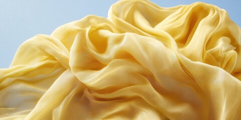 Fototapeta premium Close up picture of a yellow fabric on a blue sky background - Outdoor