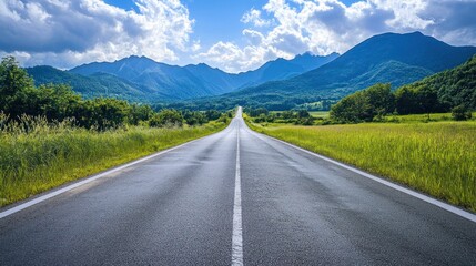 Naklejka premium Asphalt Road Leading Through Mountains