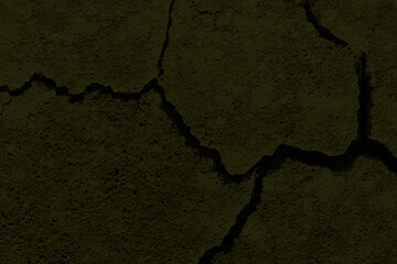 Texture of dry arid brown earth with cracks.