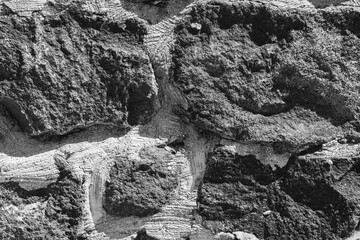 The texture of the wall is composed of gray, rough stone