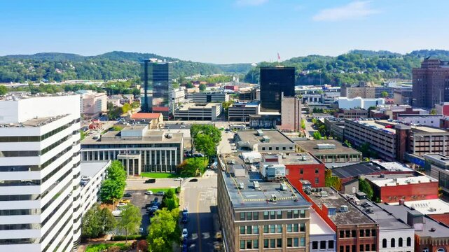 Aerial view of Charleston, West Virginia skyline, with slow camera pull-back. Charleston is the capital and most populous city of the U.S. state of West Virginia and the seat of Kanawha County