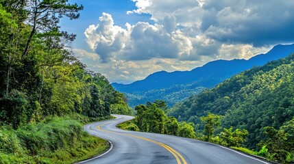 Fototapeta premium Scenic Winding Road Through Lush Mountains