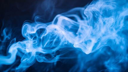 Fototapeta premium Blue smoke swirls gracefully against a dark background, creating a mesmerizing visual effect