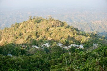 Obraz premium Houses of Bangladeshi indigenous people are in between hills