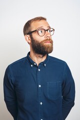 Fototapeta premium Man looking up, wearing glasses and casual outfit