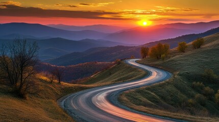 Fototapeta premium A winding road through mountains at sunset, showcasing natural beauty and tranquility.