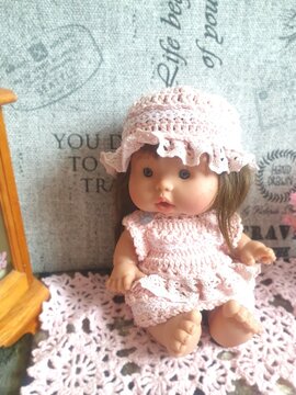 Doll in pink crochet handmade dress abd hat