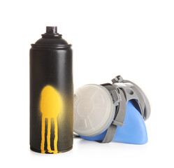 Spray paint can and respirator on white background