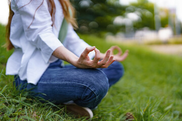 A serene moment of meditation in a lush green park on a sunny afternoon