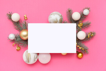 Blank card, Christmas balls and fir branches on pink background