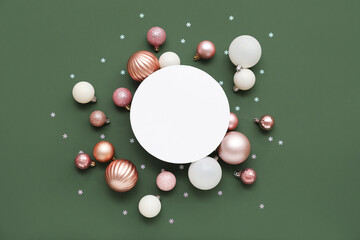 Blank card, Christmas balls and confetti on green background