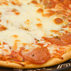 Pepperoni pizza, pizza with tomato sauce and spicy salami seasoned with paprika and chili peppers topping