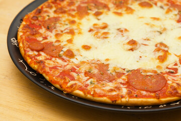 Pepperoni pizza, pizza with tomato sauce and spicy salami seasoned with paprika and chili peppers topping