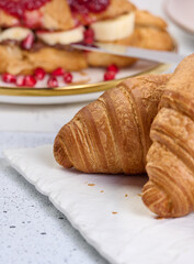Baked croissants on white table, breakfast