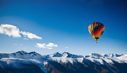 Obraz premium A Hot Air Balloon flying over the mountains