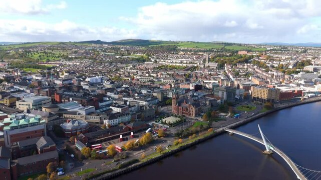City of Derry aka Londonderry in Northern Ireland aerial view - A Beautiful Cityscape from above by the River Foyle Featuring the Beautiful Pedestrian Peace Bridge