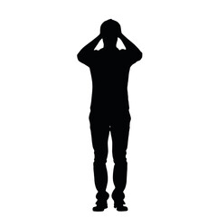 Fototapeta premium A silhouette of a person standing with their hands covering their face