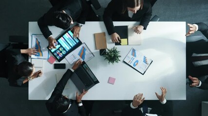 Top down aerial view of smart businessman use vr headset to enter virtual world at meeting while diverse business people send financial information and data analysis graph in database. Directorate. - Powered by Adobe